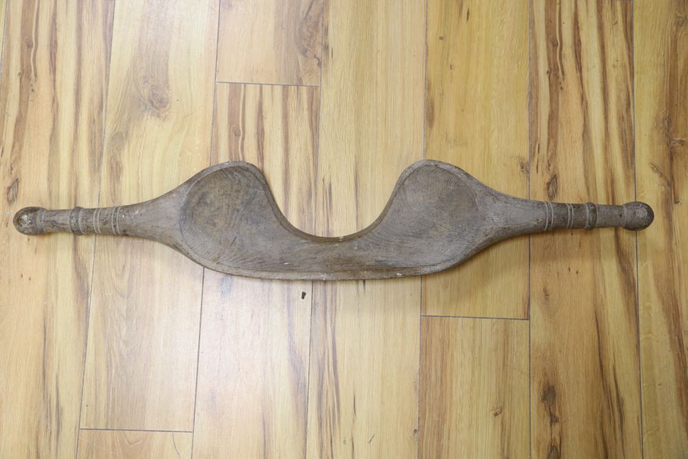 A 19th century carved wood dairy yoke